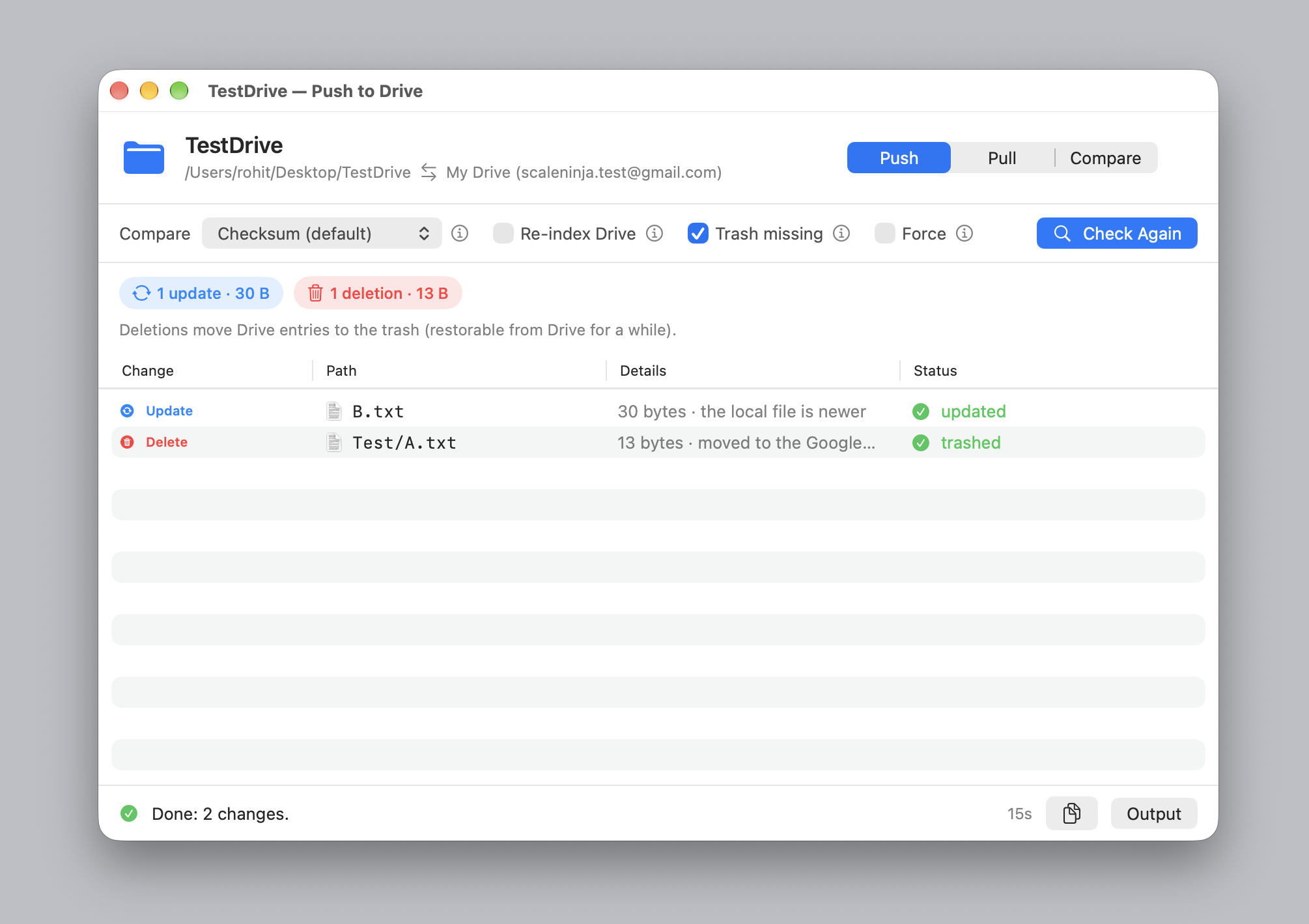 The push window after a run: one update and one deletion, each listed with its reason and marked done in the status column.